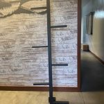 Unique ladder design that would go on an RV as well. The goose in the background is wall art